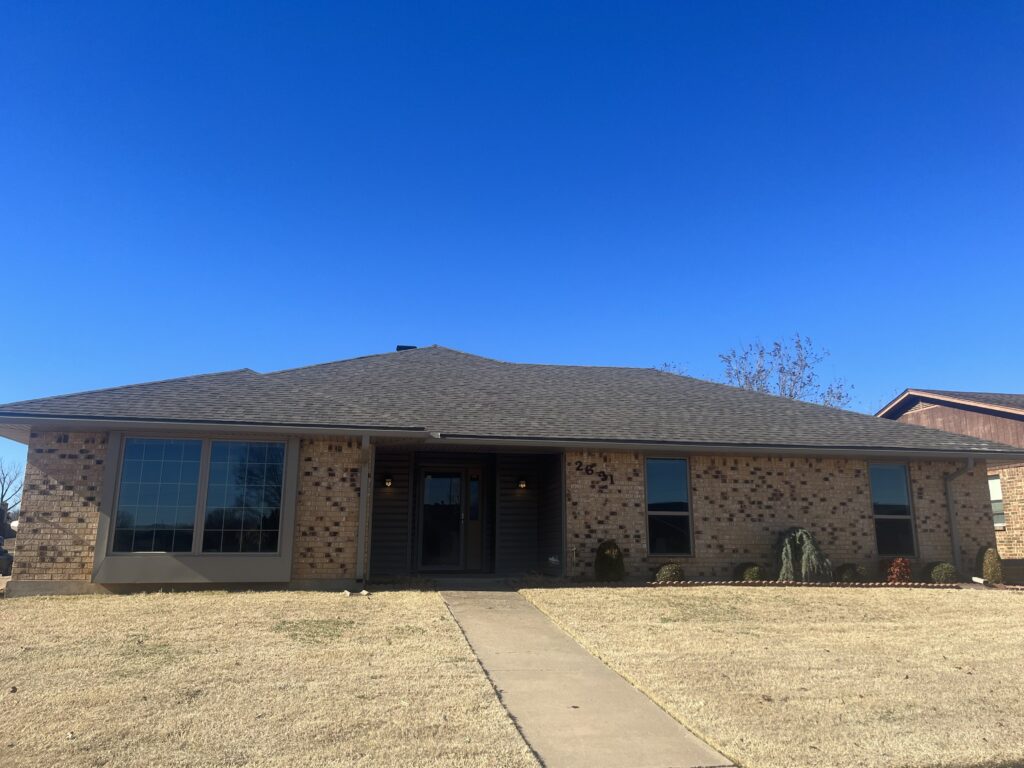 Oklahoma Roofing Experts crew installing new roofing materials on residential property
