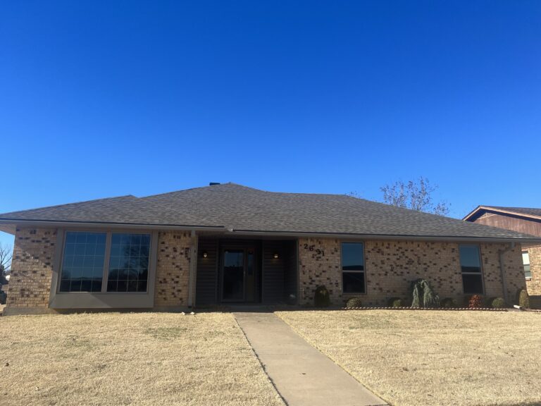 Oklahoma Roofing Experts crew installing new roofing materials on residential property