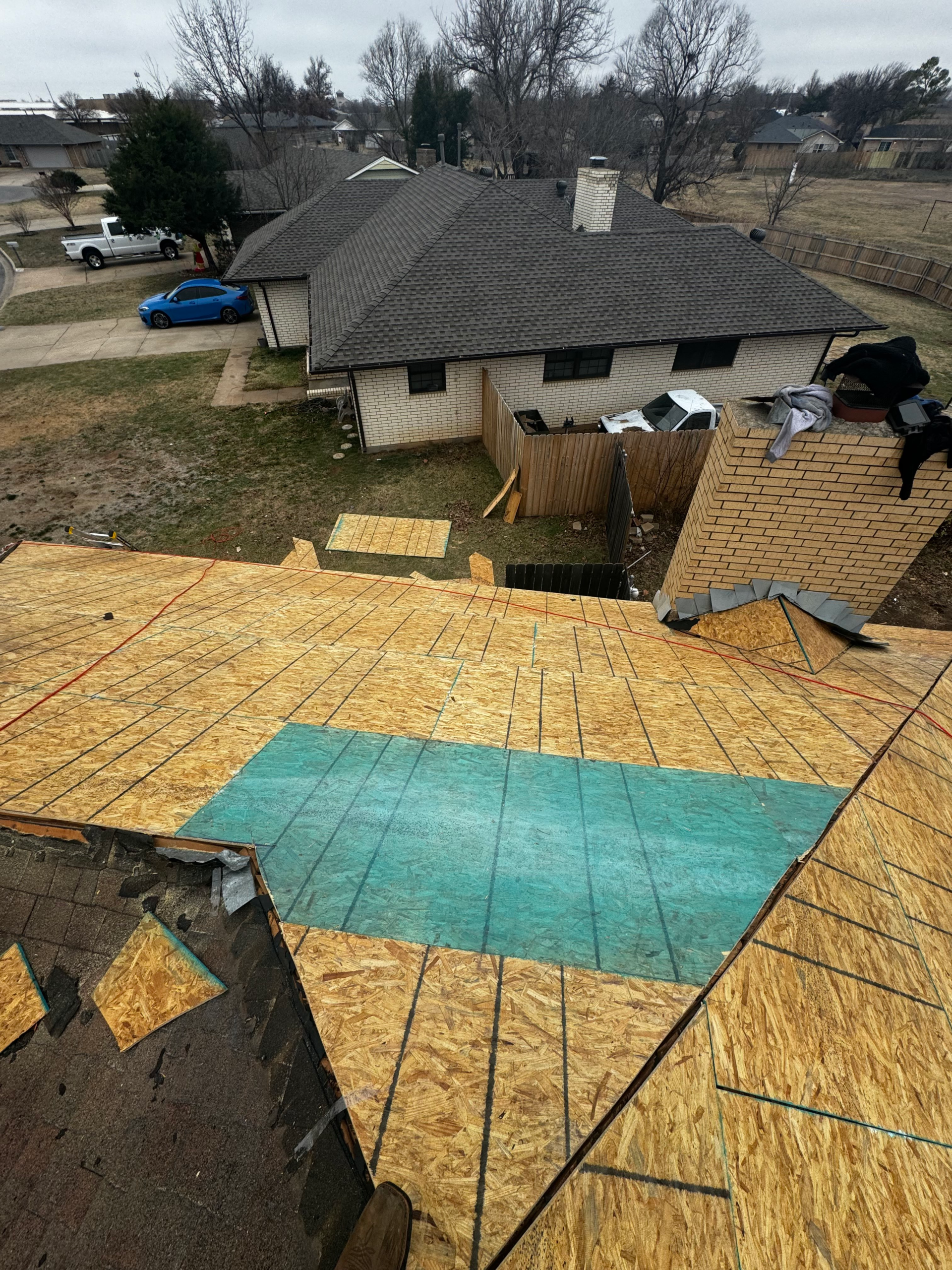 Residential roof replacement in progress in Ada, Oklahoma by Oklahoma Roofing Experts