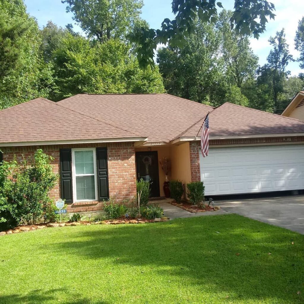 Completed asphalt shingle roof replacement on brick ranch home in Oklahoma City area
